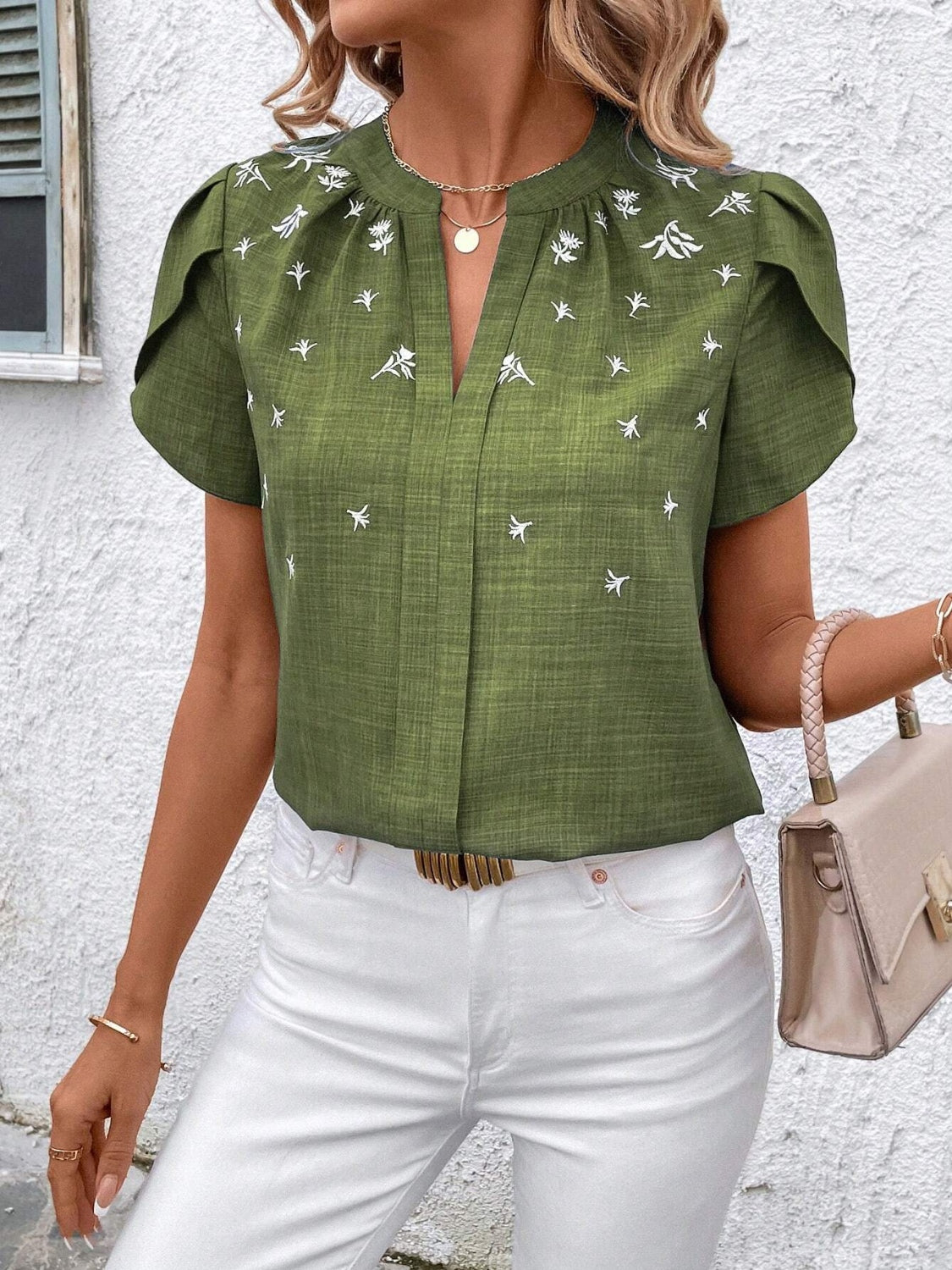 Floral notched short sleeve blouse.