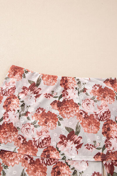 Floral off-shoulder long sleeve bodysuit.