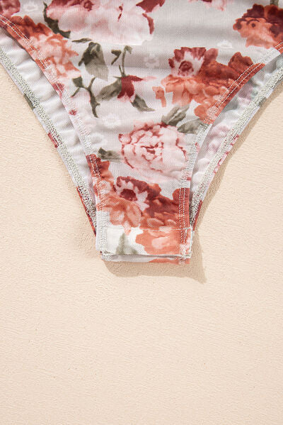 Floral off-shoulder long sleeve bodysuit.