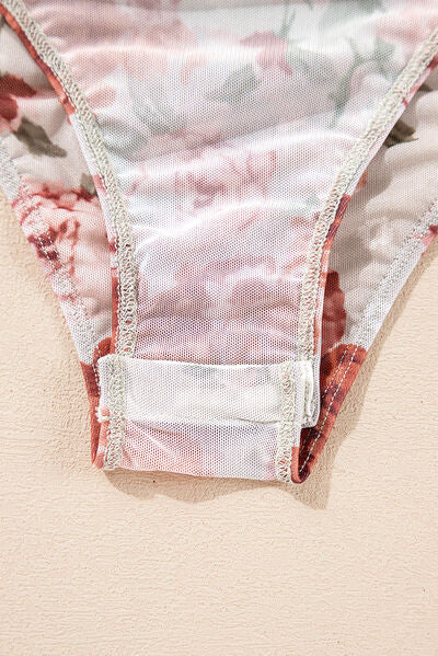 Floral off-shoulder long sleeve bodysuit.