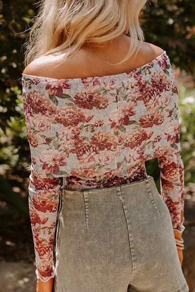 Floral off-shoulder long sleeve bodysuit.