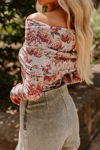 Floral off-shoulder long sleeve bodysuit.
