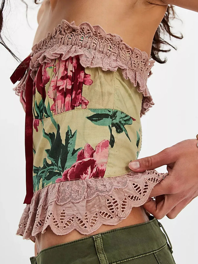 Floral print tube top with lace trim and bow.