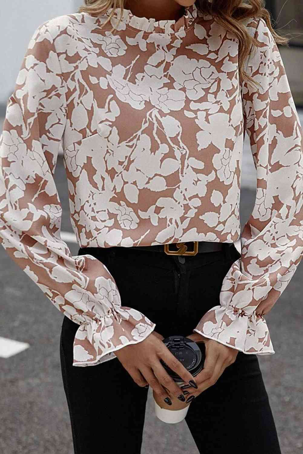 Floral print mock neck flounce sleeve blouse with ruffles.