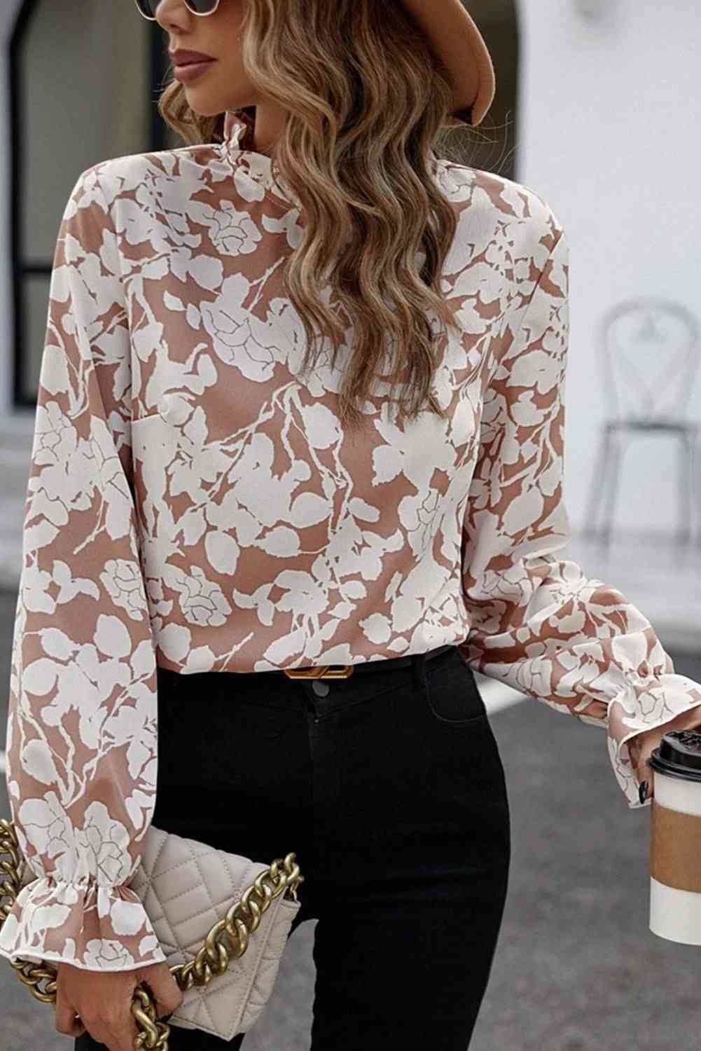 Floral print mock neck flounce sleeve blouse with ruffles.