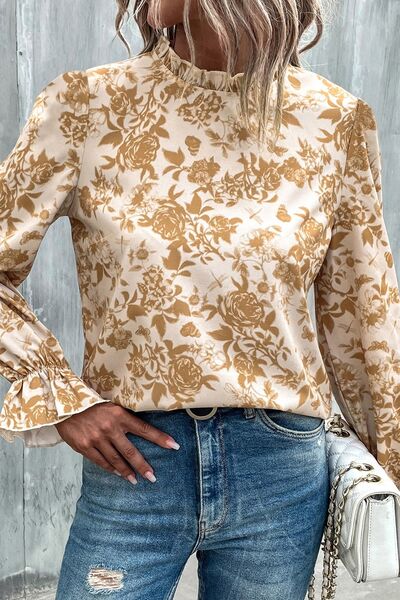 Floral print mock neck flounce sleeve blouse with ruffles.