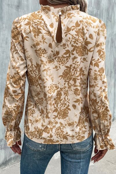 Floral print mock neck flounce sleeve blouse with ruffles.