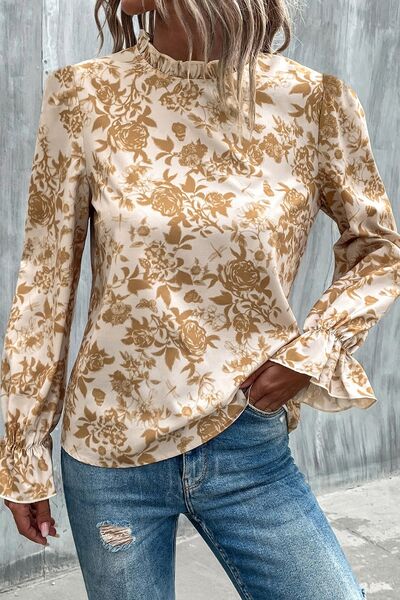 Floral print mock neck flounce sleeve blouse with ruffles.