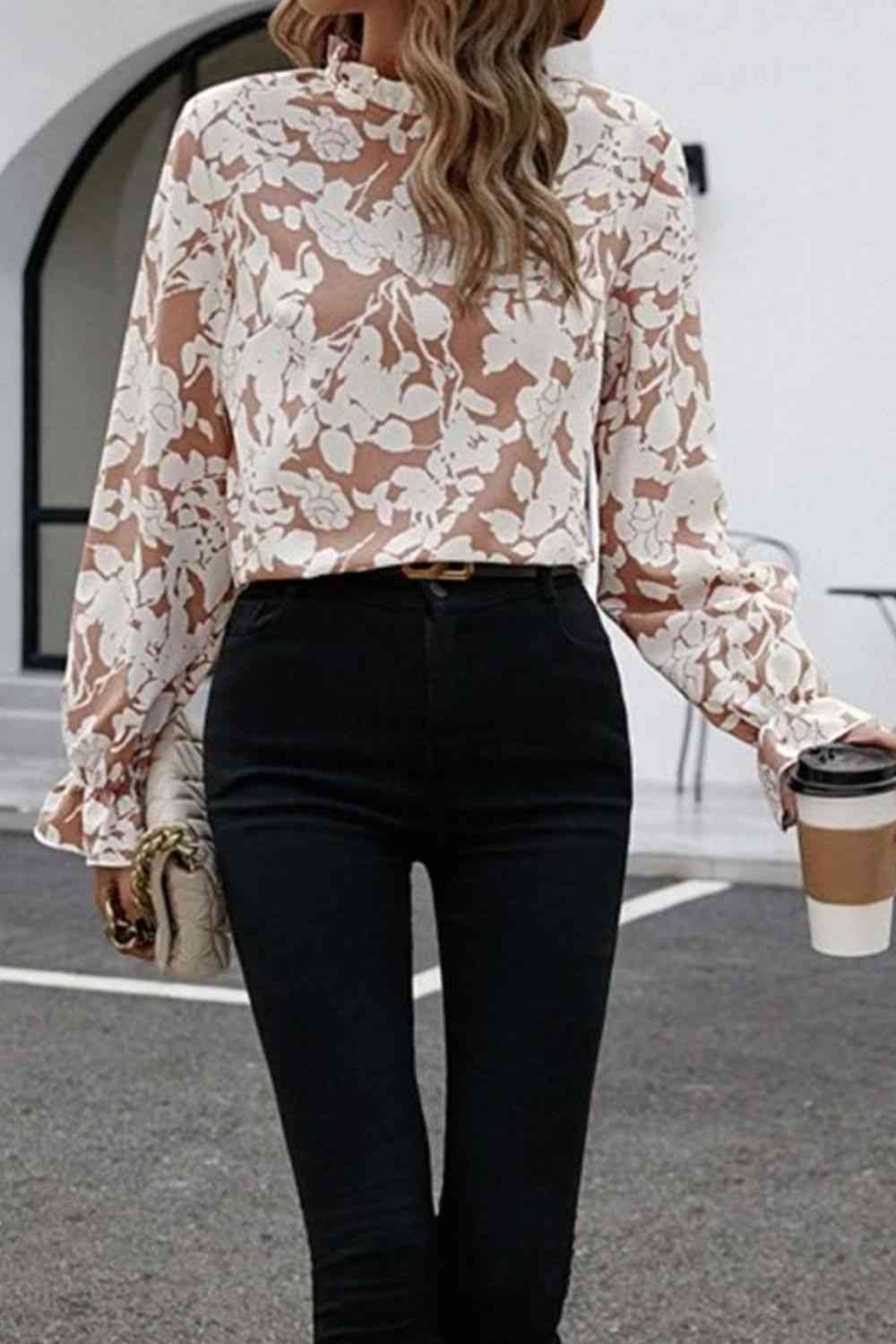Floral print mock neck flounce sleeve blouse with ruffles.