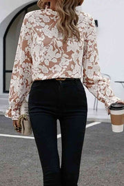 Floral print mock neck flounce sleeve blouse with ruffles.