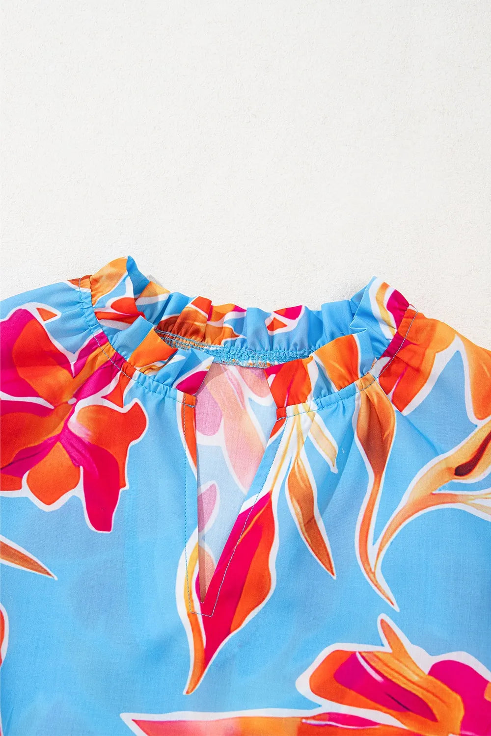 Floral Print Notched Pompom Trim Flutter Sleeve Blouse.
