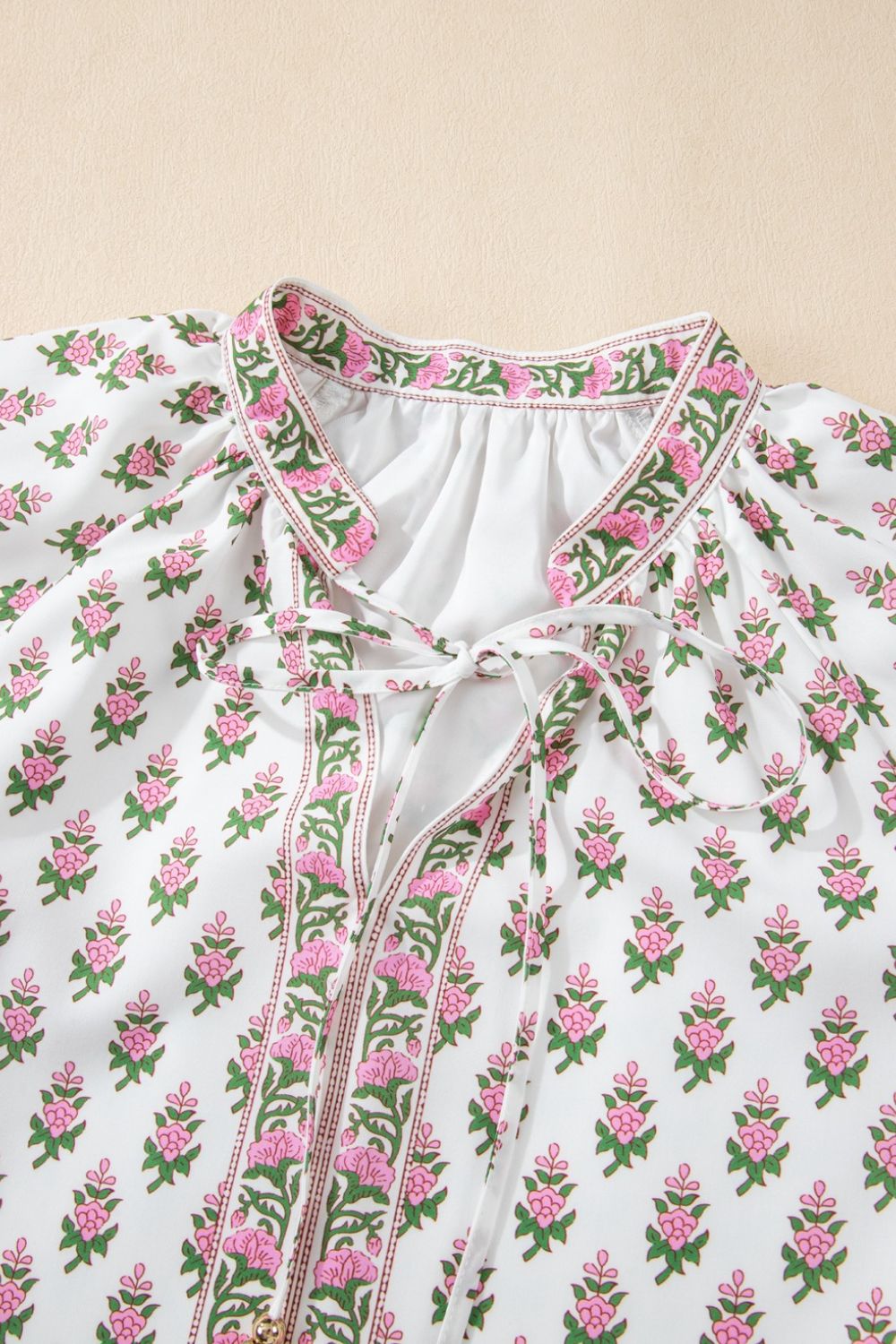 Floral Print Puff Sleeve Tie Neck Ruffled Hem Dress.