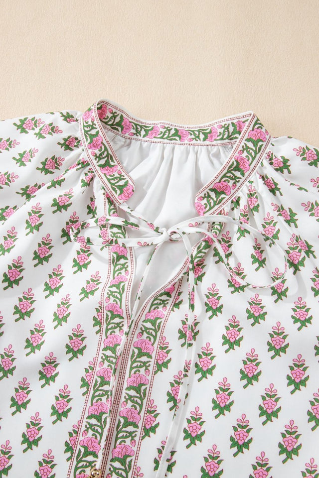 Floral Print Puff Sleeve Tie Neck Ruffled Hem Dress.