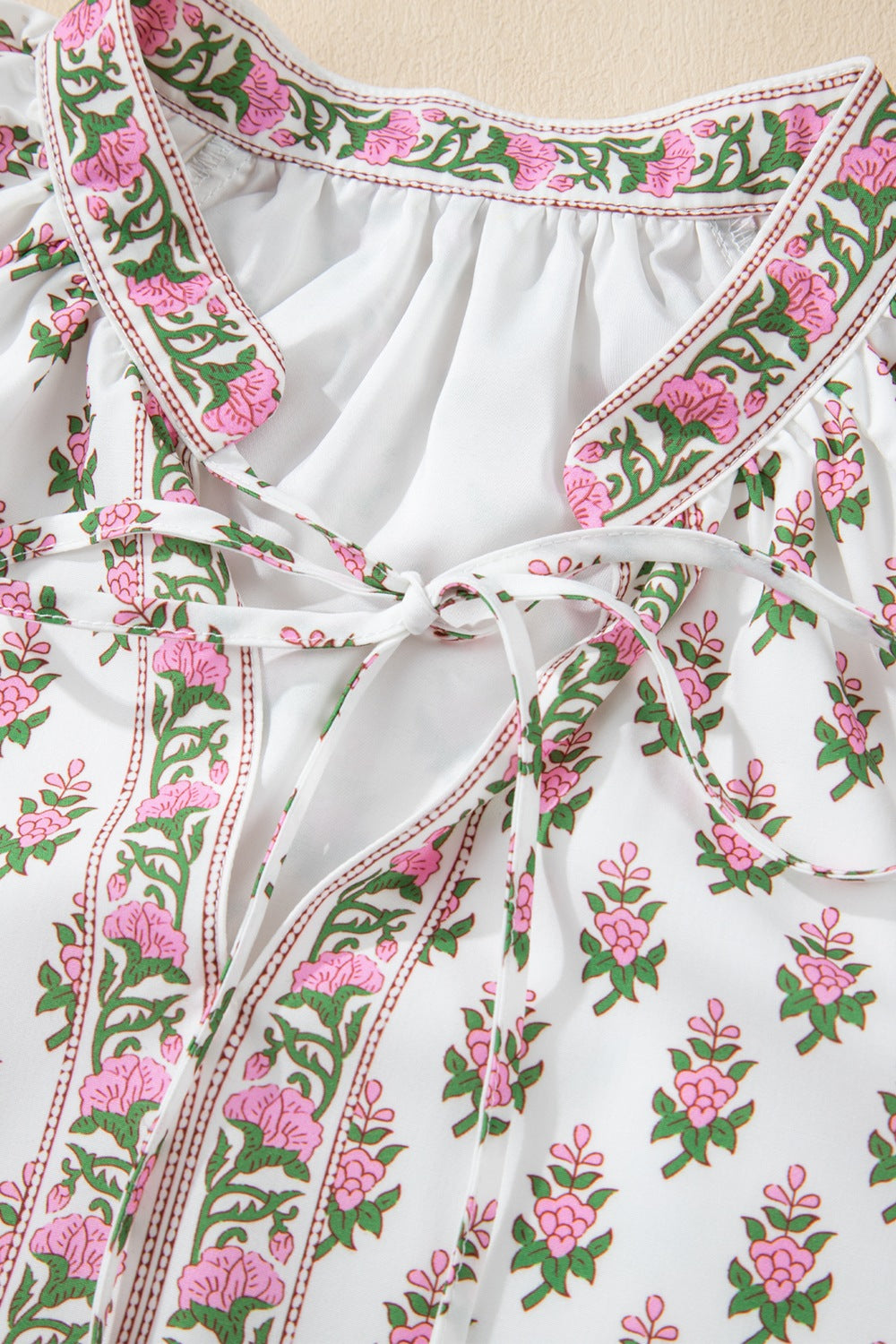 Floral Print Puff Sleeve Tie Neck Ruffled Hem Dress.