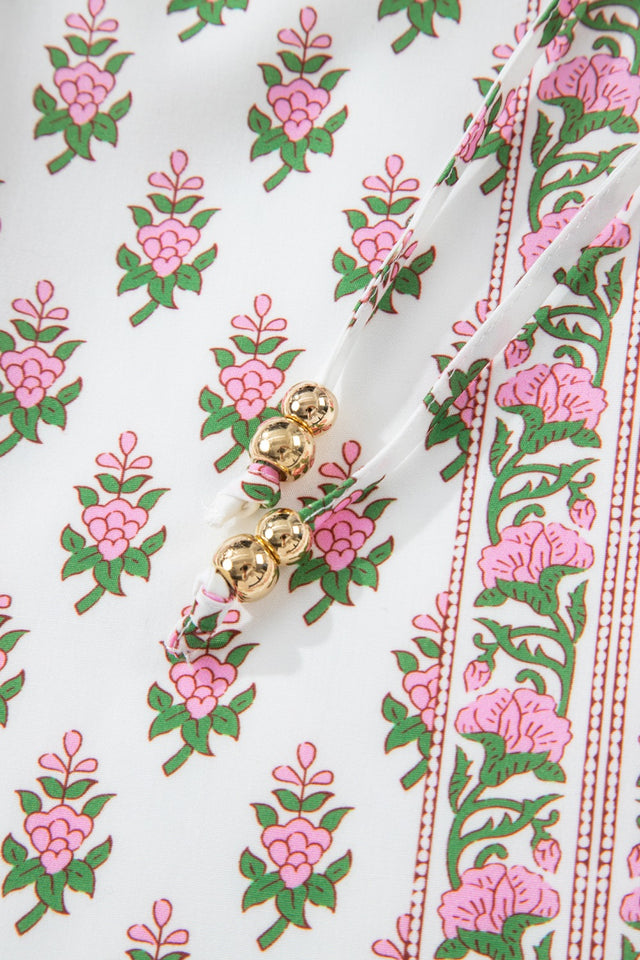 Floral Print Puff Sleeve Tie Neck Ruffled Hem Dress.