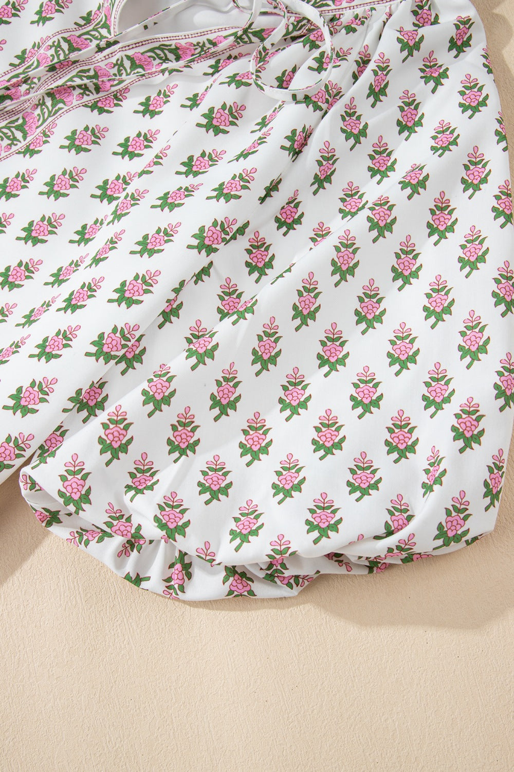 Floral Print Puff Sleeve Tie Neck Ruffled Hem Dress.