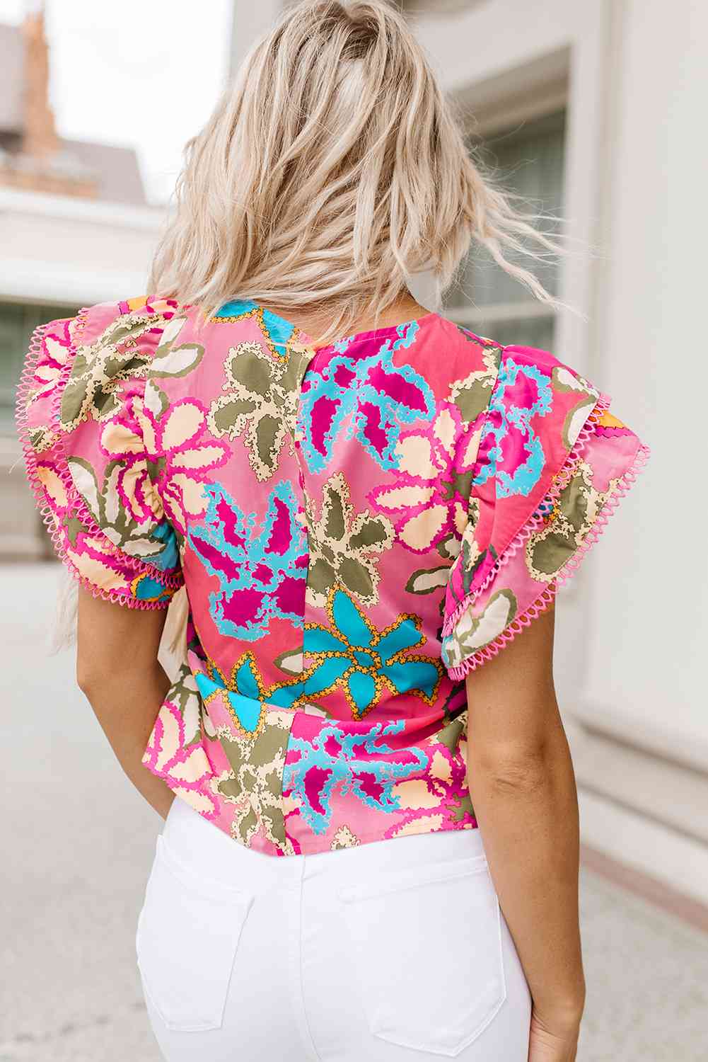 Floral print round neck flutter sleeve blouse.