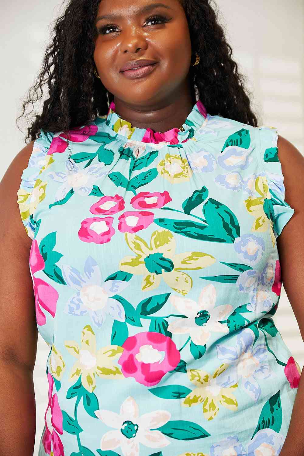 Double Take floral print ruffle shoulder blouse.