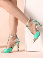 Floral print T-strap high heel sandals.