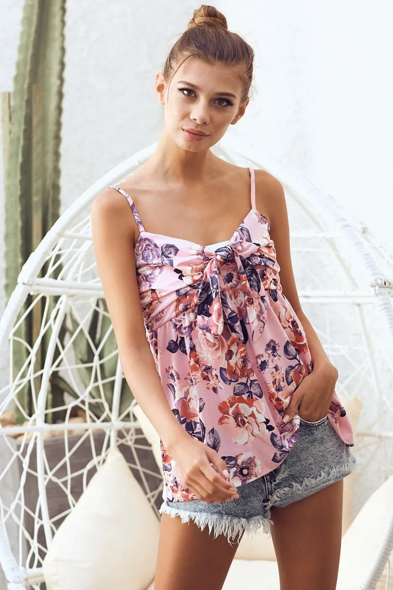 Floral printed jersey knit with tie ribbon front and ruffled details, slightly stretchy.
