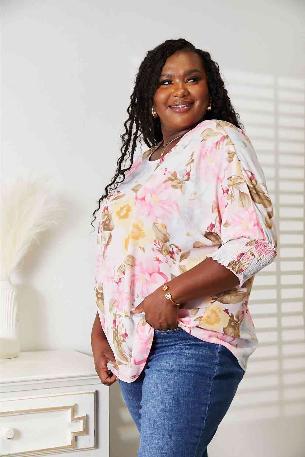 Double Take floral round neck three-quarter sleeve top.