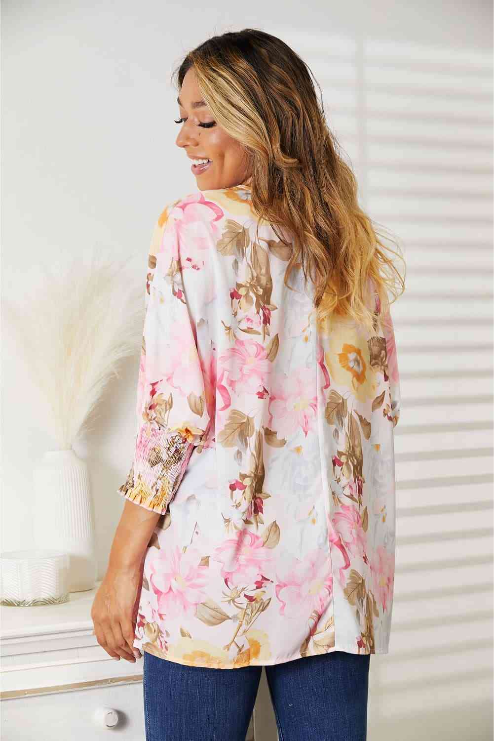 Double Take floral round neck three-quarter sleeve top.