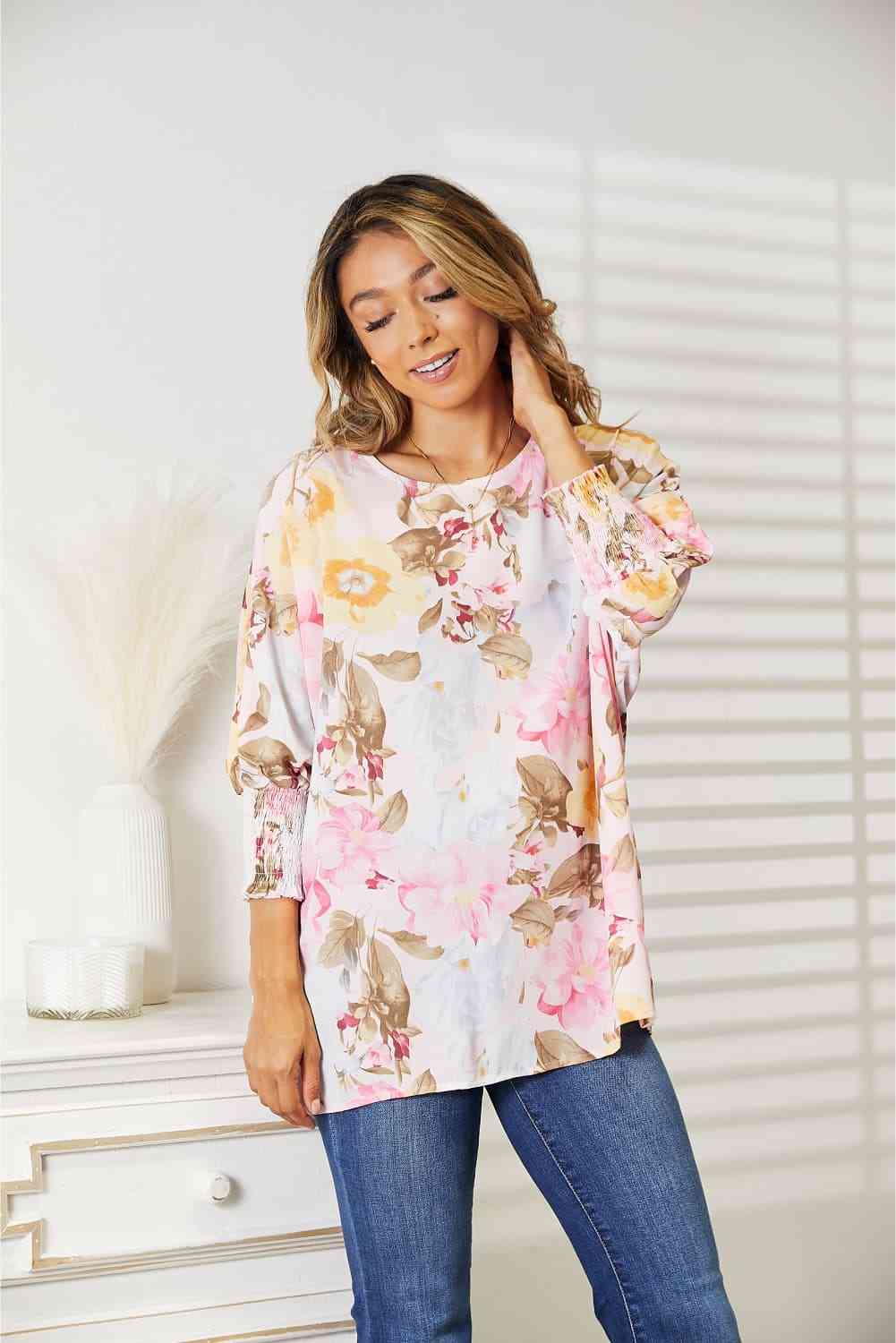 Double Take floral round neck three-quarter sleeve top.