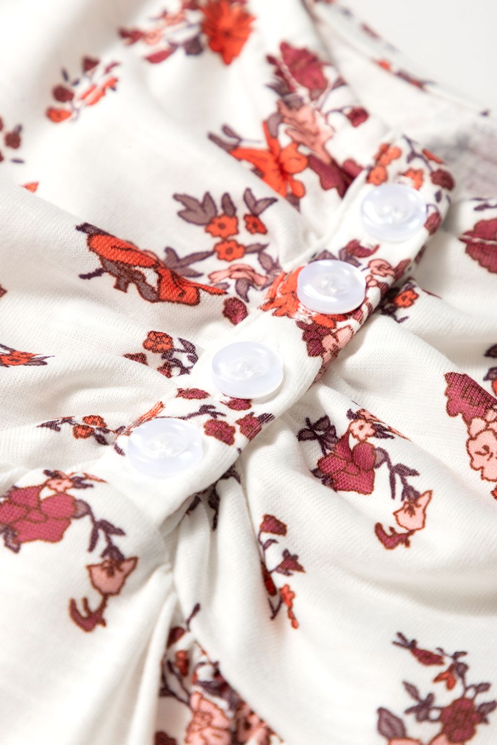 Floral ruched cinched short sleeve blouse.