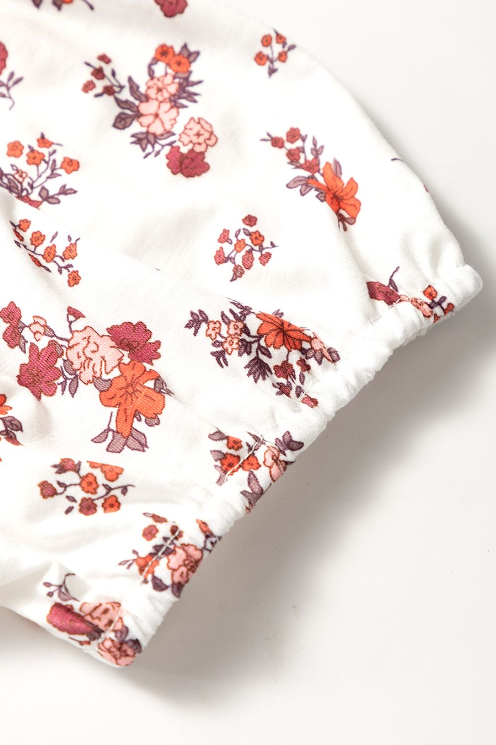 Floral ruched cinched short sleeve blouse.