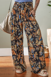 Floral shirred high waist wide leg pants with tie, opaque.