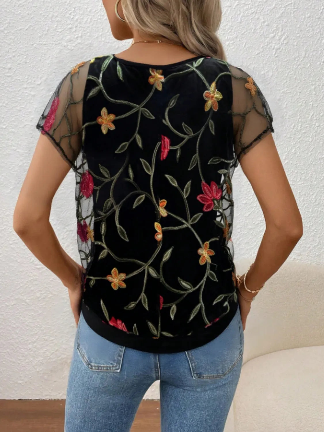 Floral short sleeve sheer top.