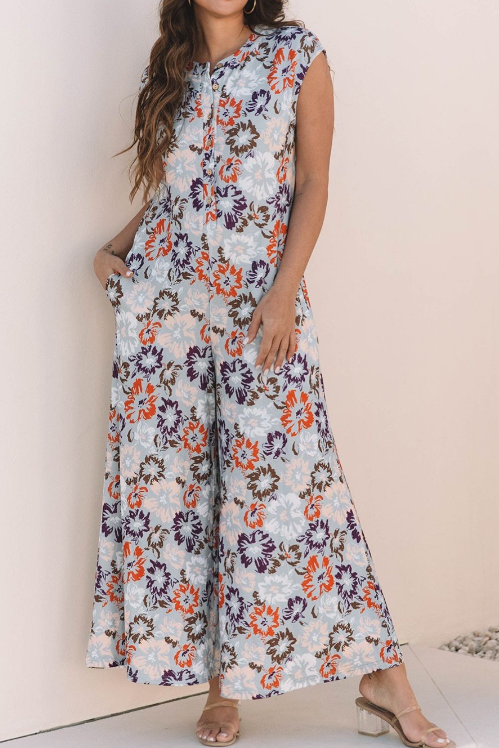 Floral Sleeveless Button Front Wide Leg Jumpsuit.