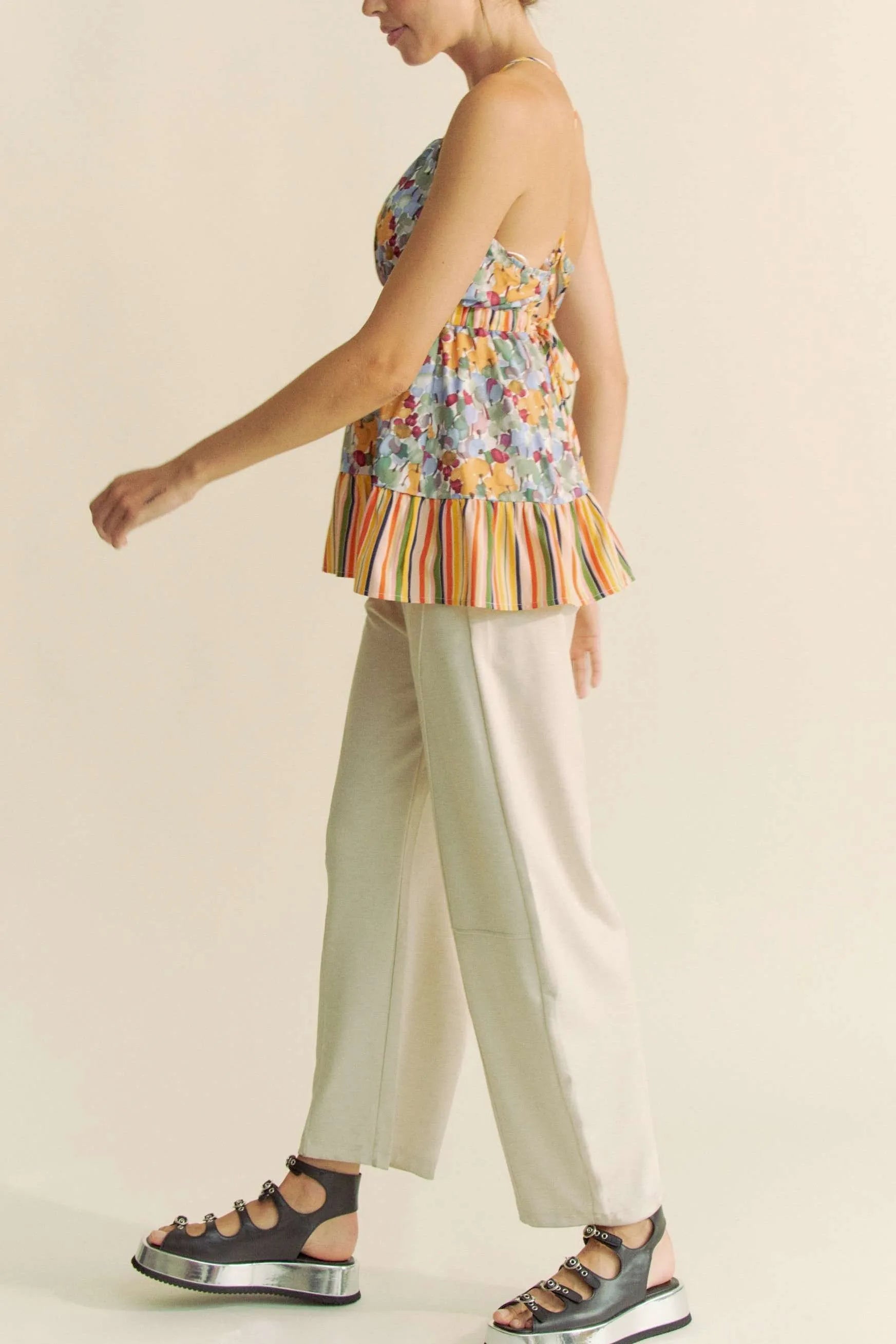 Floral smocked sleeveless top with ruffle and back tie.