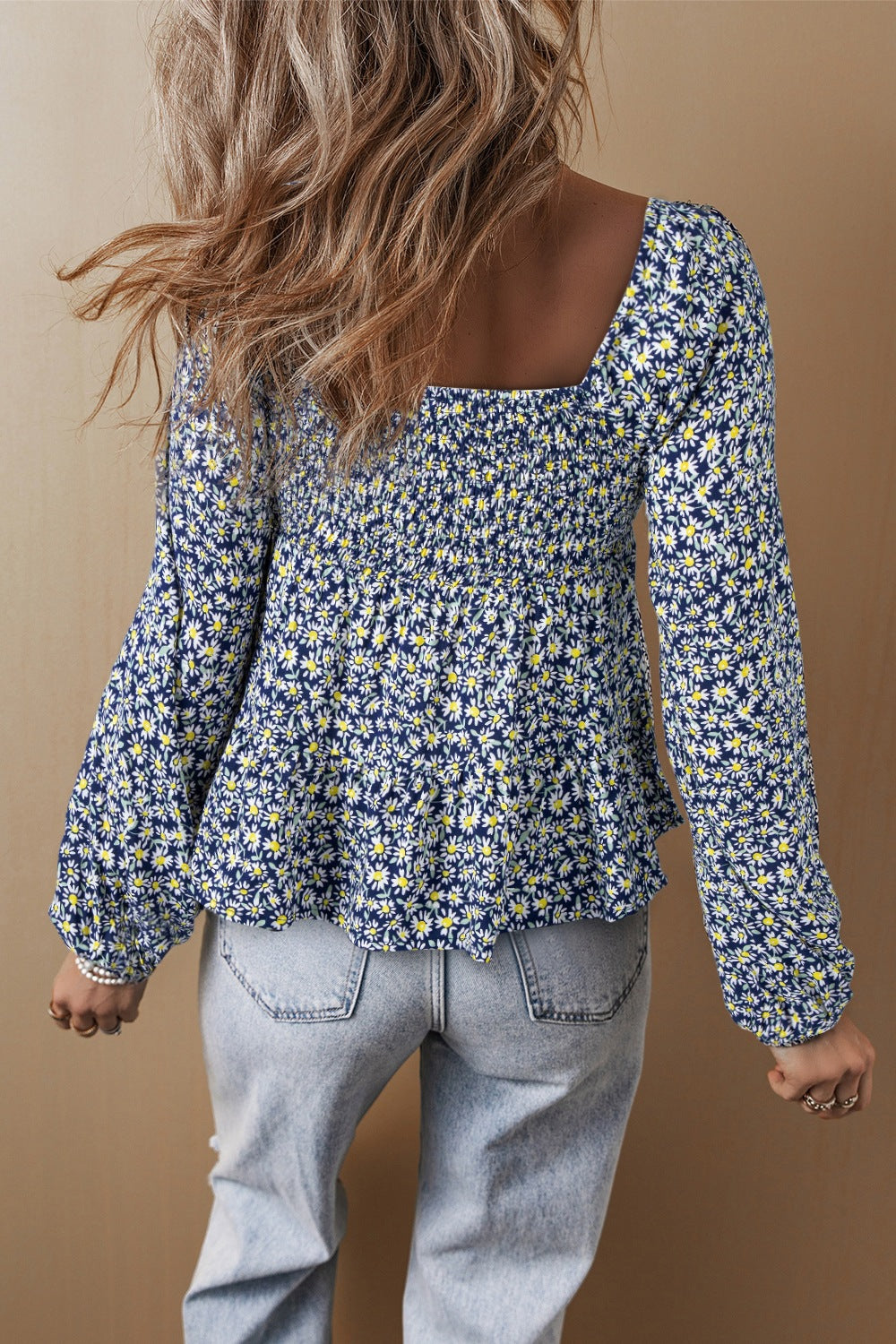 Floral smocked square neck blouse.
