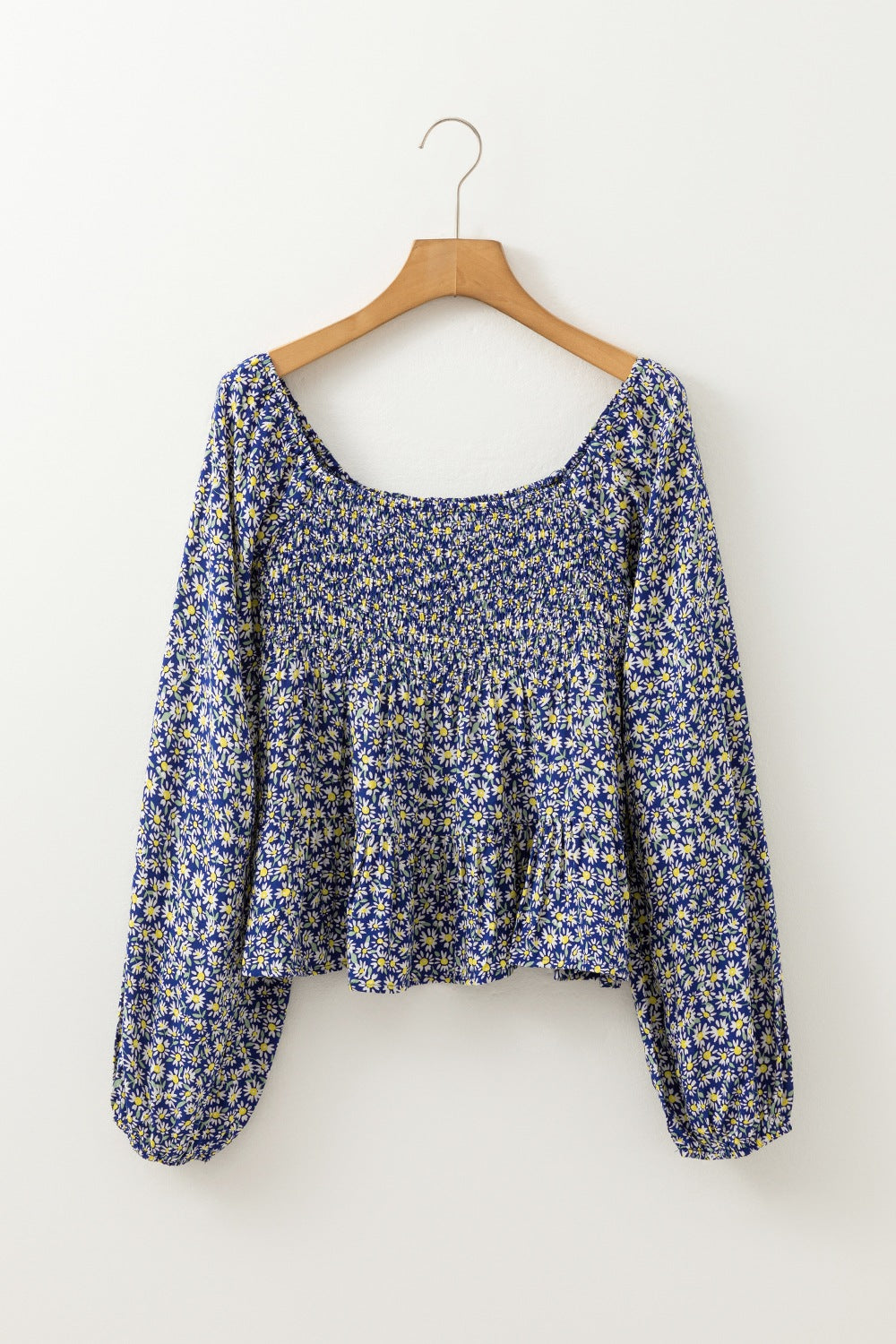 Floral smocked square neck blouse.
