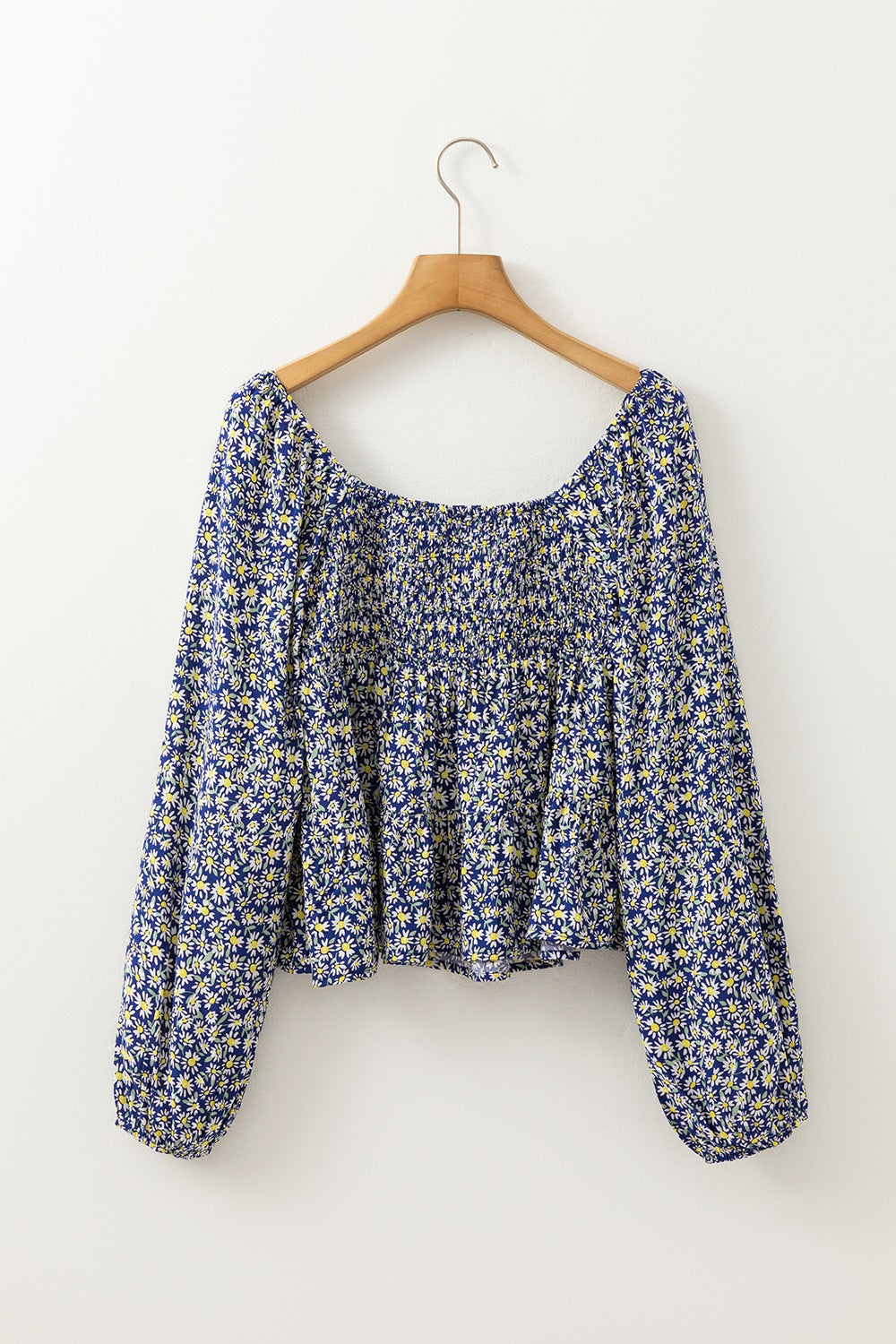 Floral smocked square neck blouse.