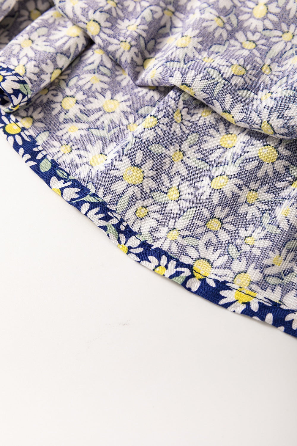 Floral smocked square neck blouse.
