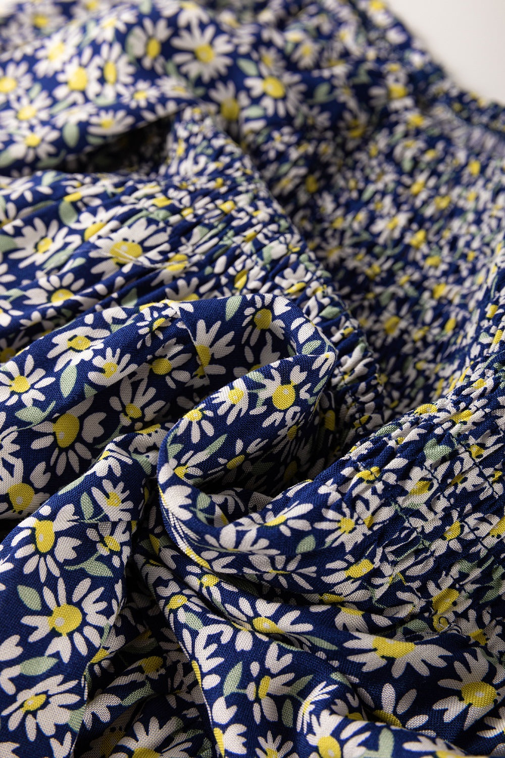 Floral smocked square neck blouse.