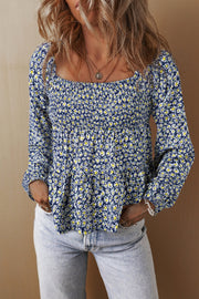 Floral smocked square neck blouse.