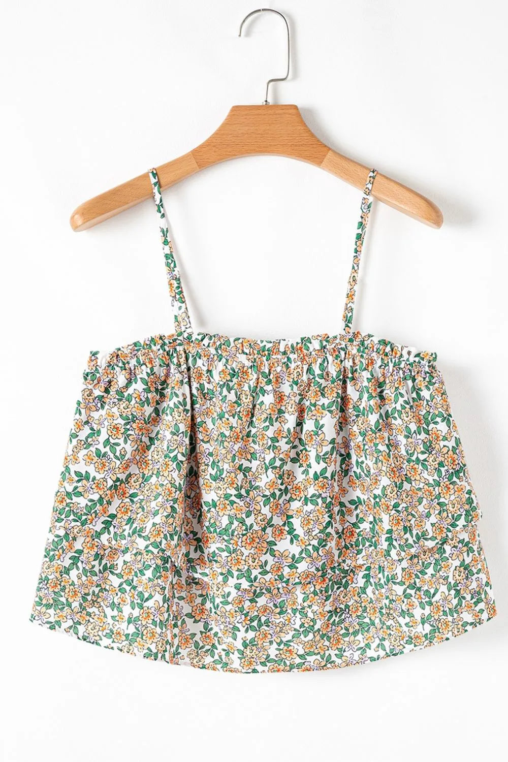 Floral spaghetti strap ruffled cami with layered design.