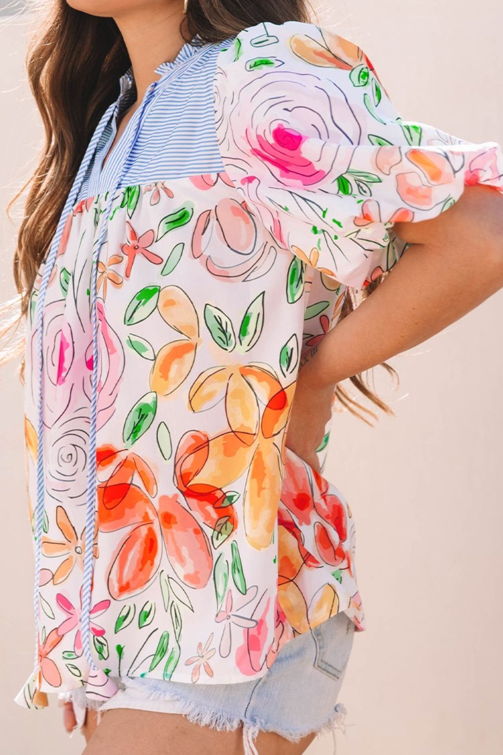 Floral striped yoke frilled tie neck puff short sleeve blouse.