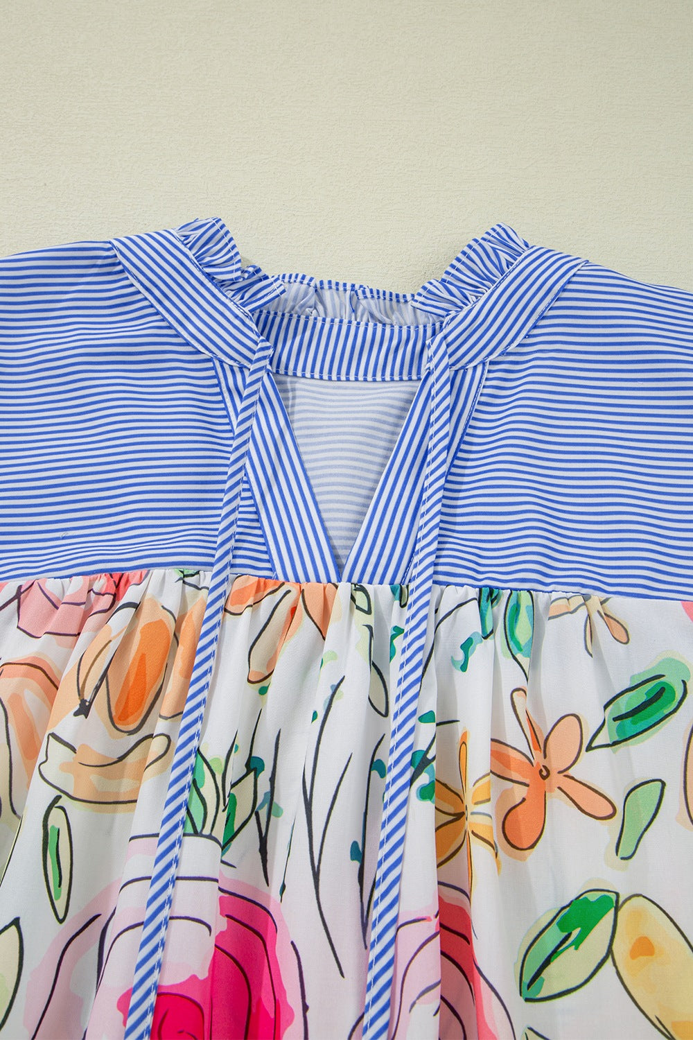 Floral striped yoke frilled tie neck puff short sleeve blouse.