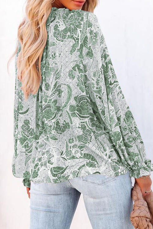 Floral tie neck flounce sleeve blouse.