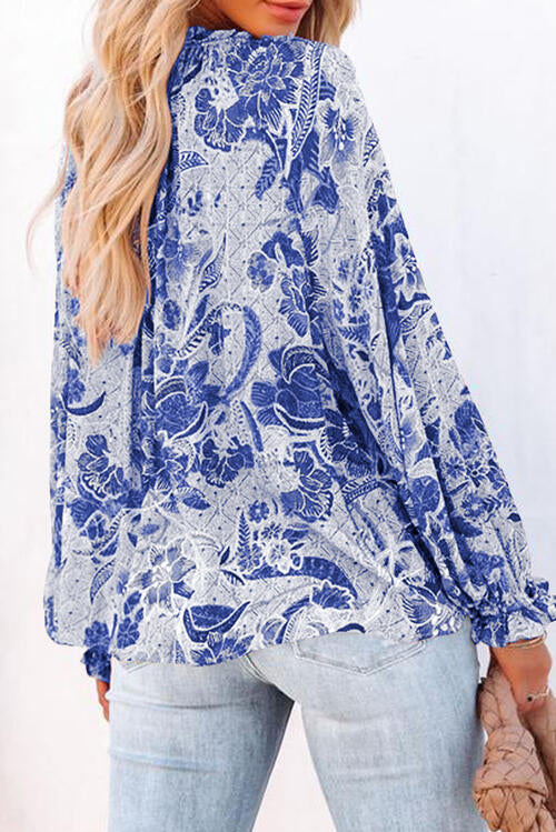 Floral tie neck flounce sleeve blouse.