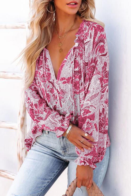 Floral tie neck flounce sleeve blouse.