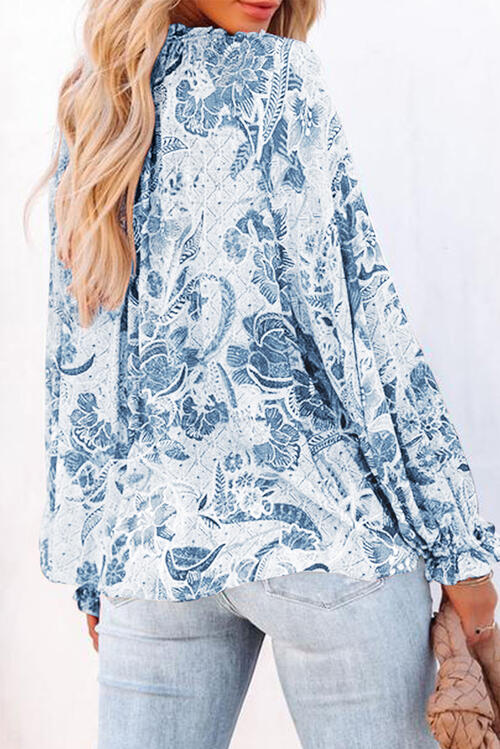 Floral tie neck flounce sleeve blouse.