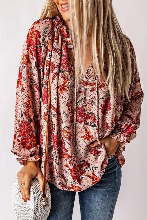 Floral tie neck flounce sleeve blouse.