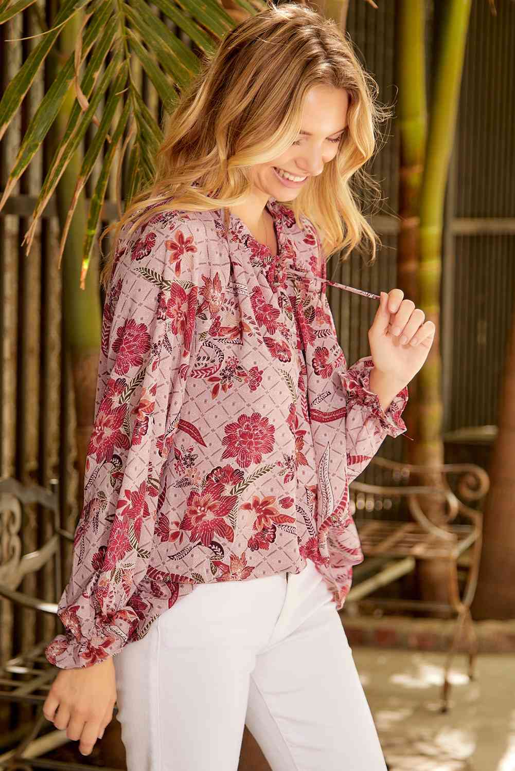 Floral tie neck flounce sleeve blouse.
