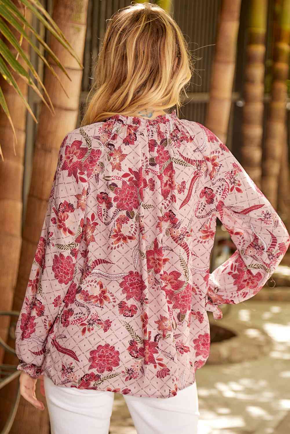 Floral tie neck flounce sleeve blouse.
