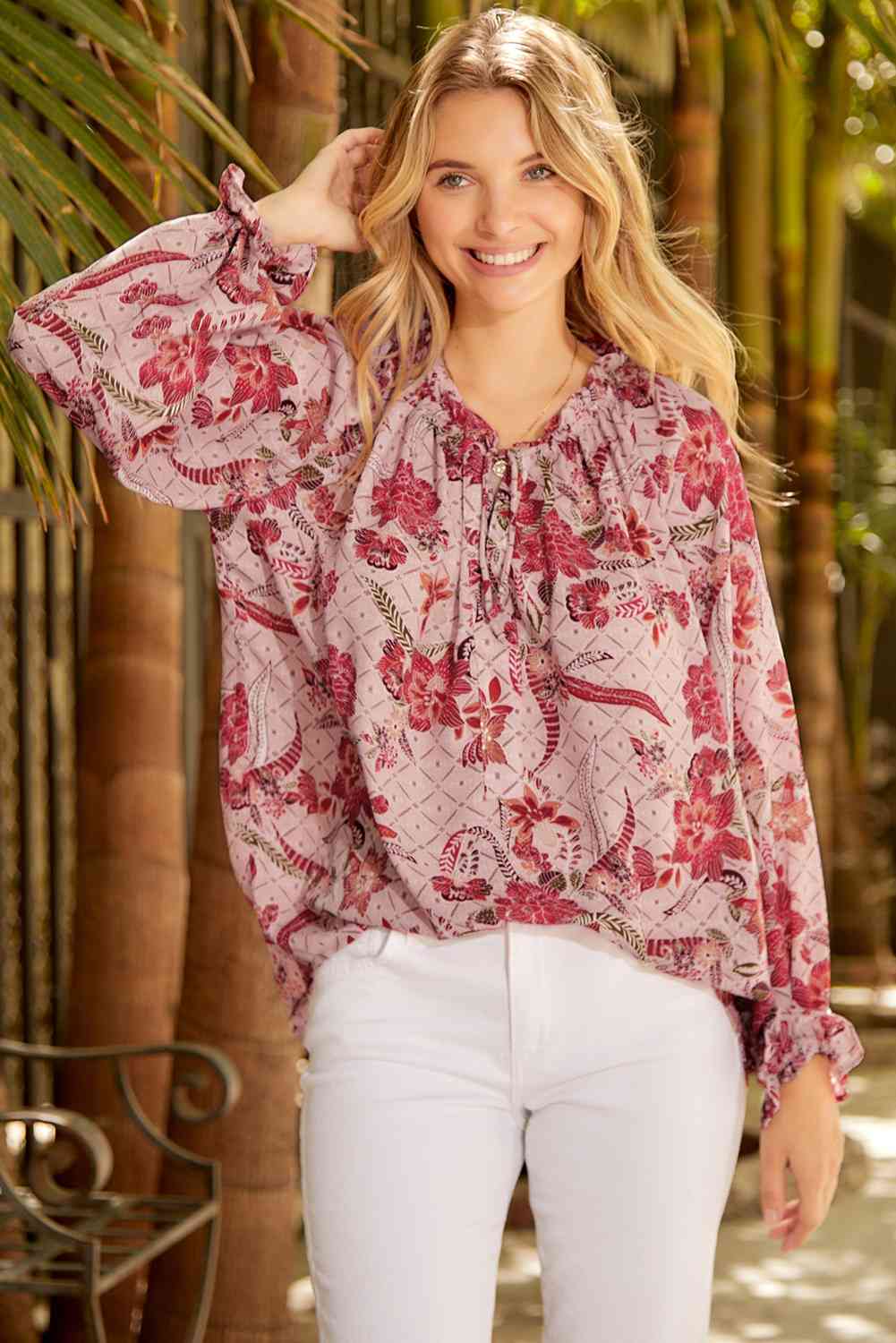 Floral tie neck flounce sleeve blouse.